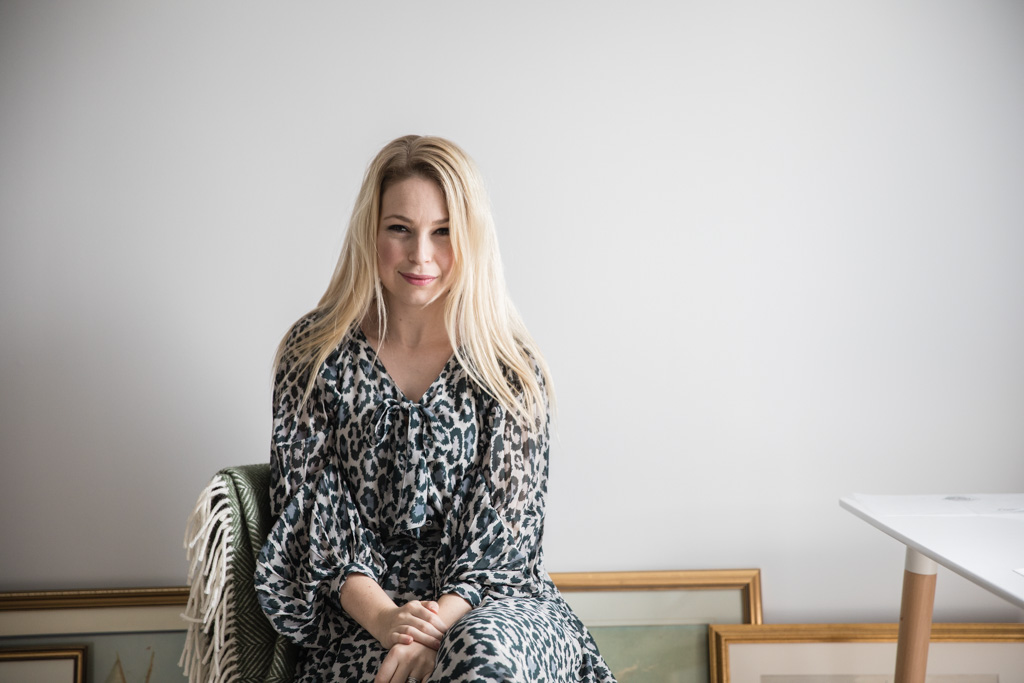 Botanical Illustrator Charlotte Argyrou in her home studio. London, UK advising on how to choose a picture frame. 